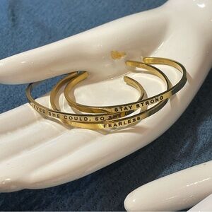 (3) Three MantraBand Gold Tone Bracelets